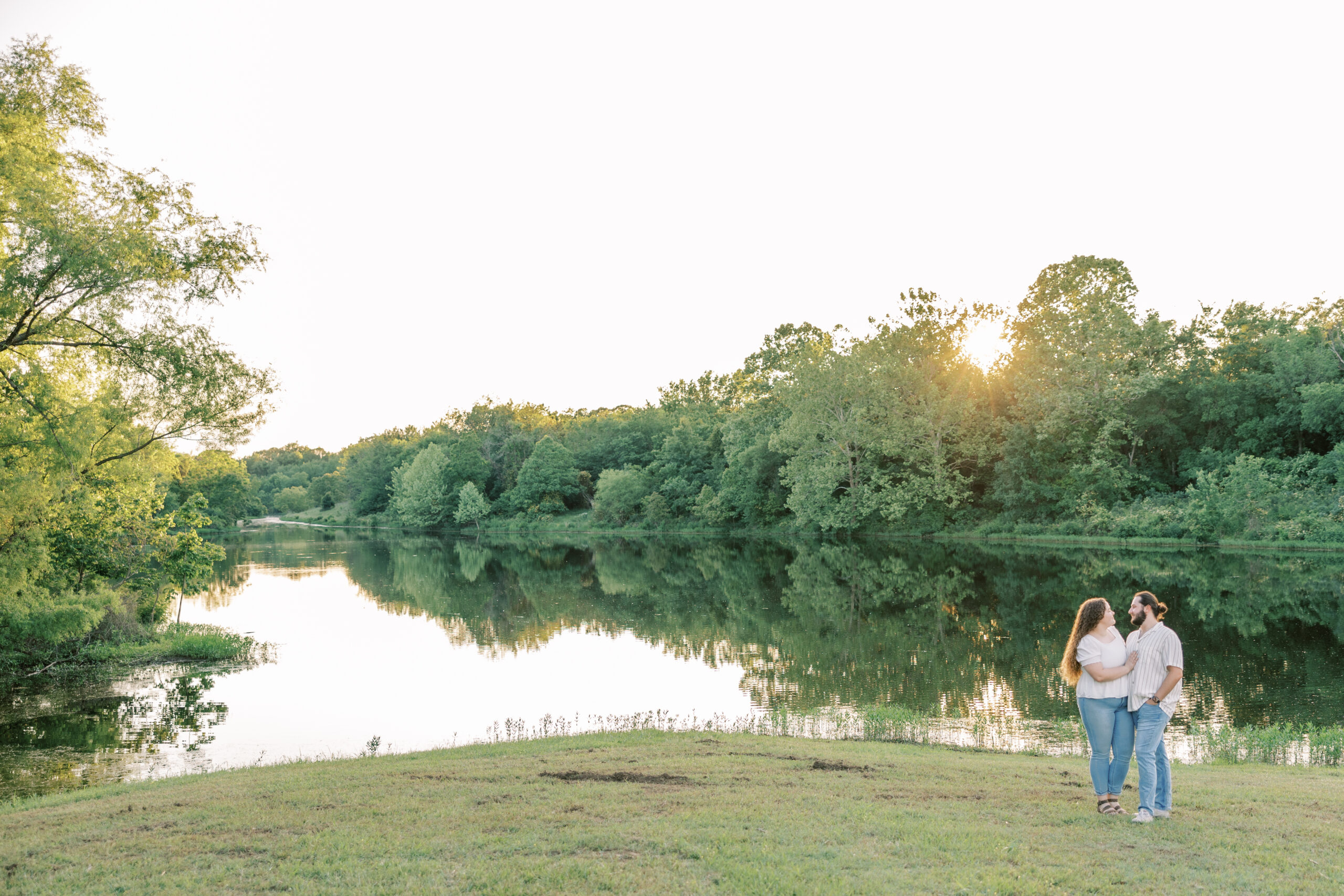 Engagement picture with a pond in the background